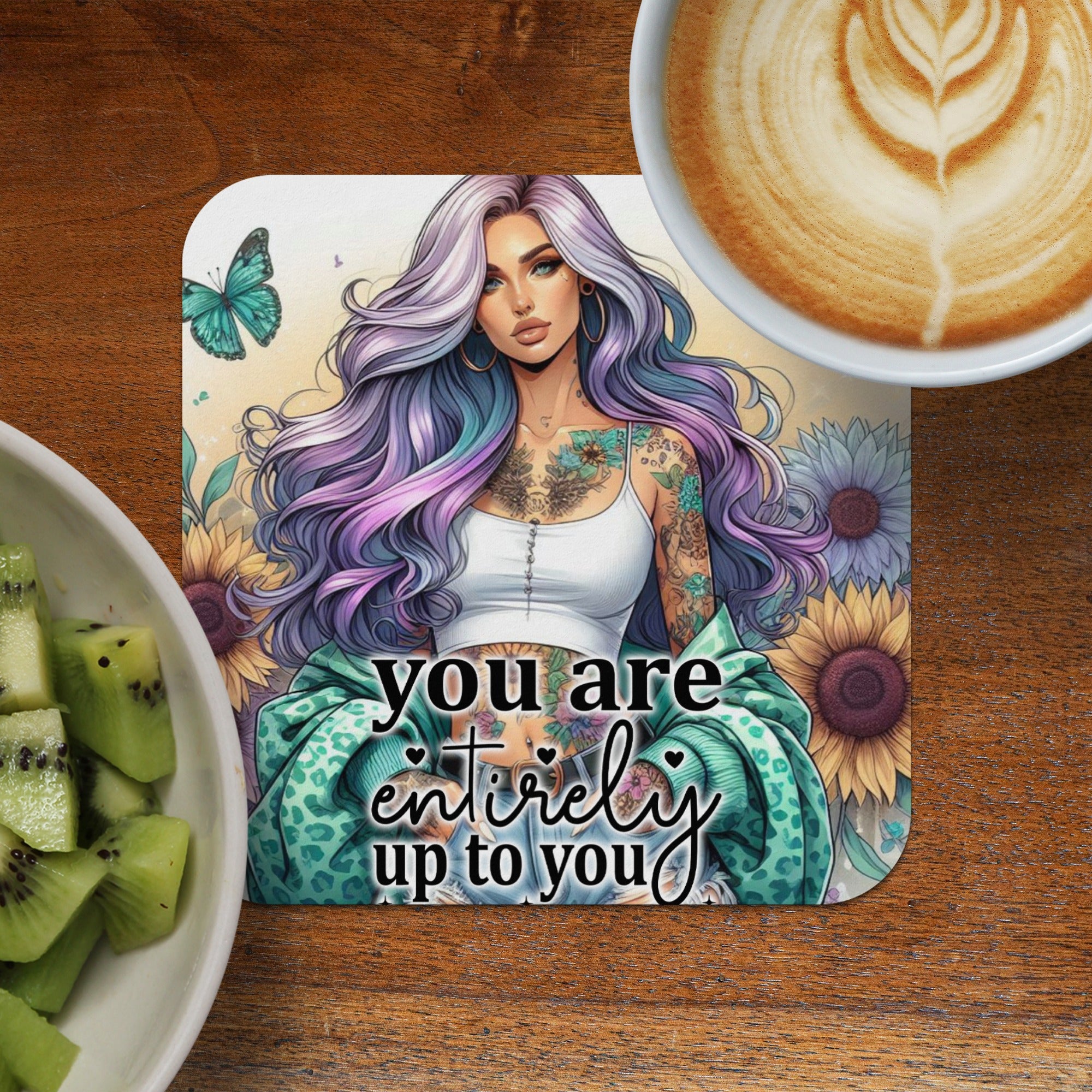 Woman with tattoos and purple hair, text "You are entirely up to you," with latte and kiwi.