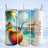 Three tumblers with tropical drinks and beach scenes, one personalized with "Amelia."