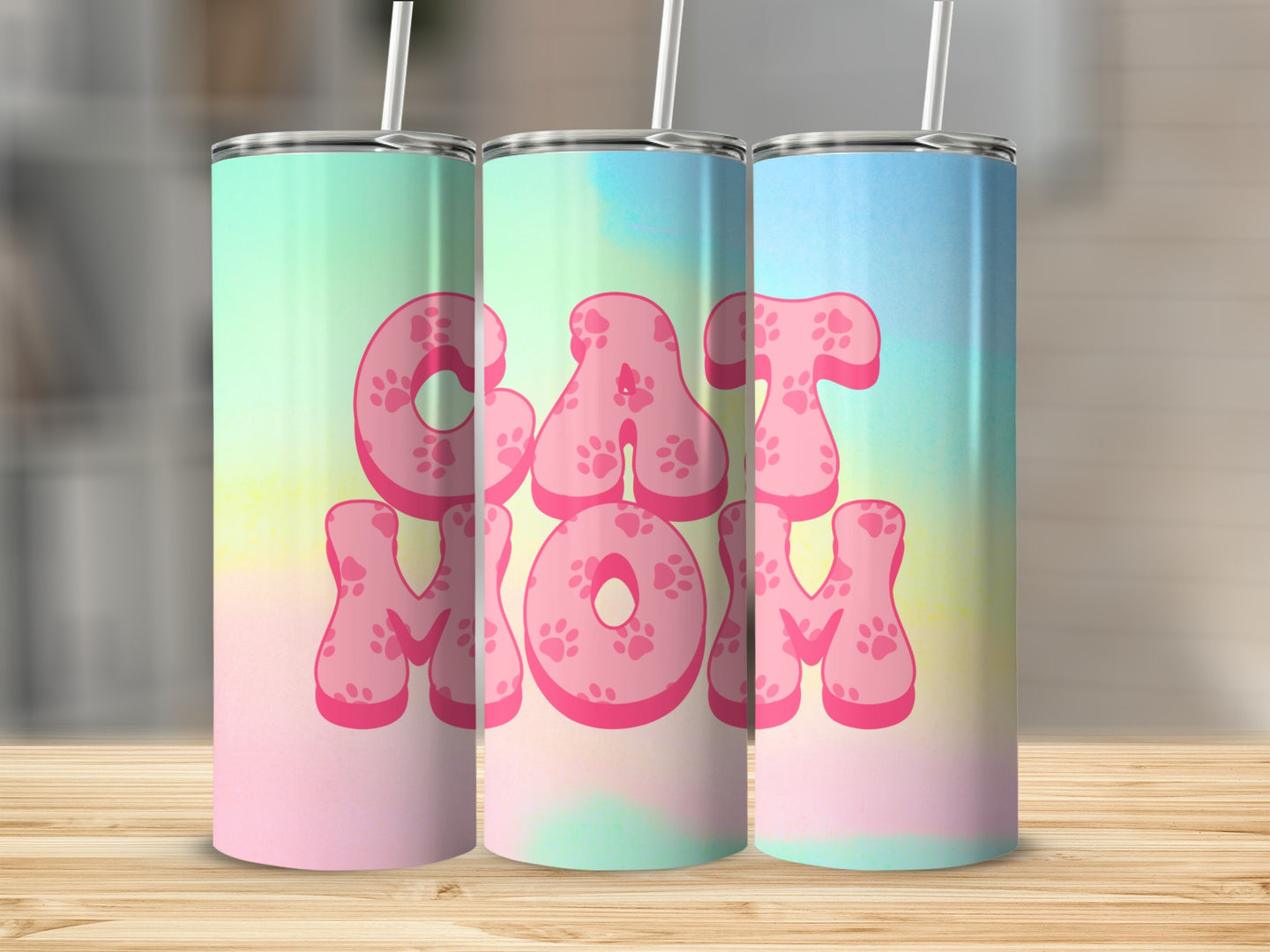 Cat Mom tumbler with paw print accents and a pastel watercolor background.
