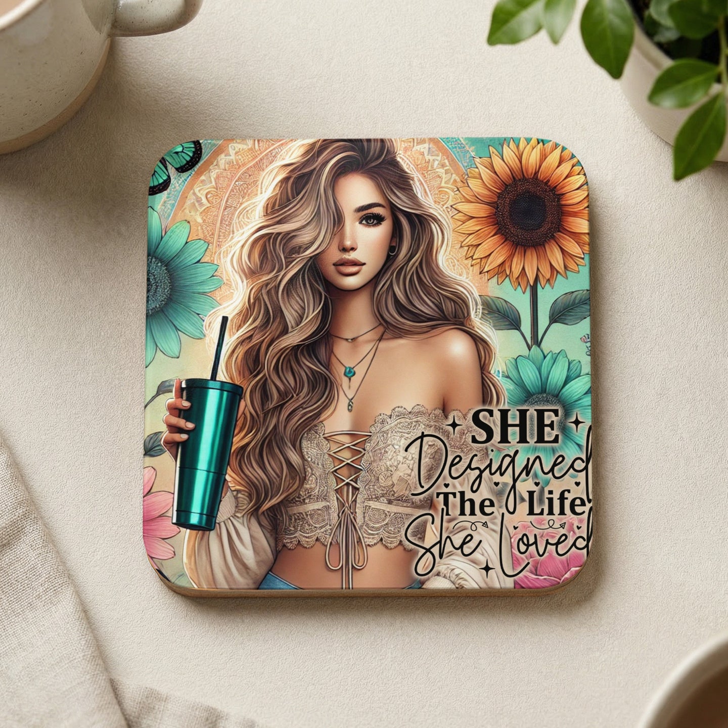 Woman holding teal cup with "SHE Designed the Life She Loved" text.