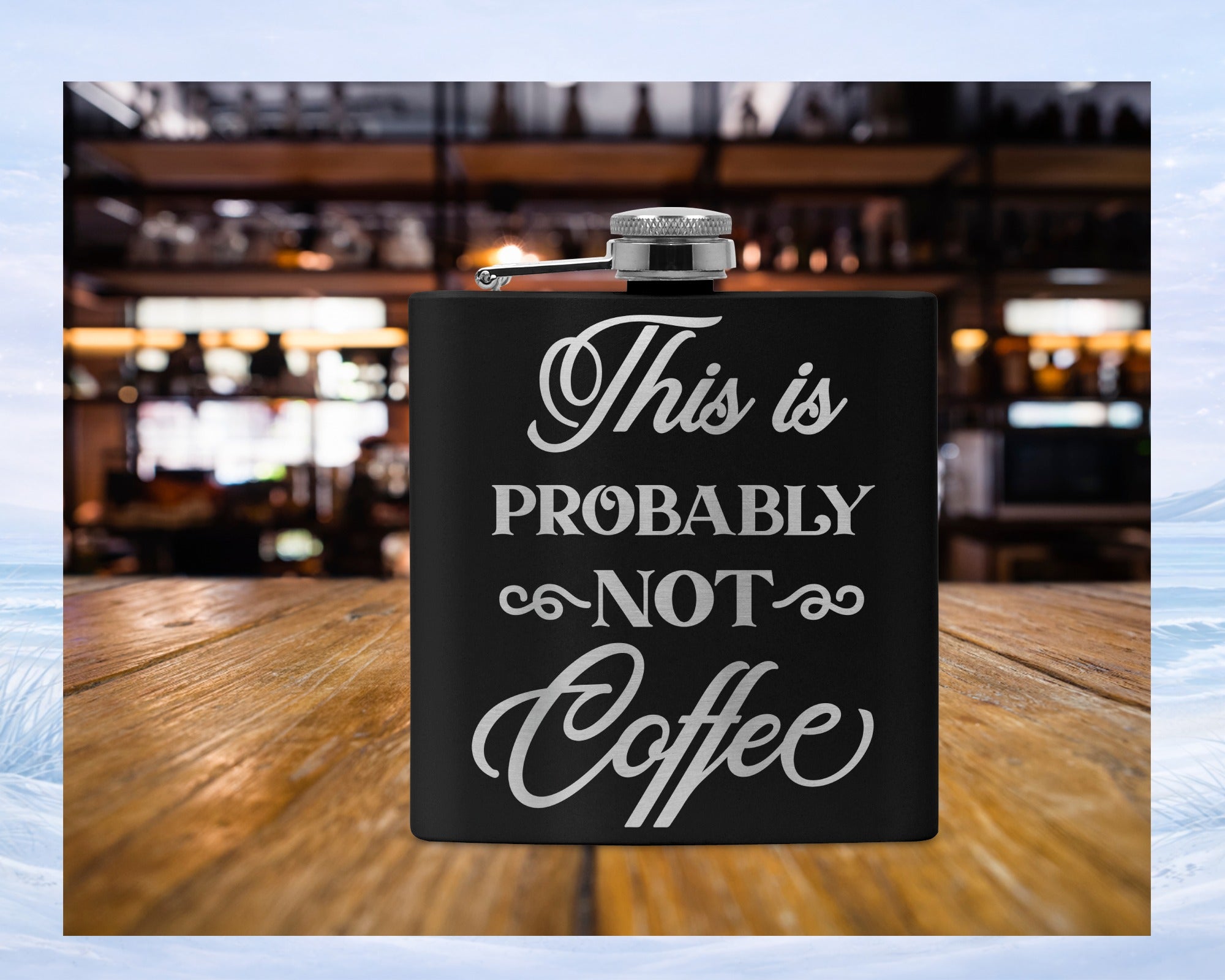 Black flask with "This is PROBABLY NOT Coffee" text on wooden surface.