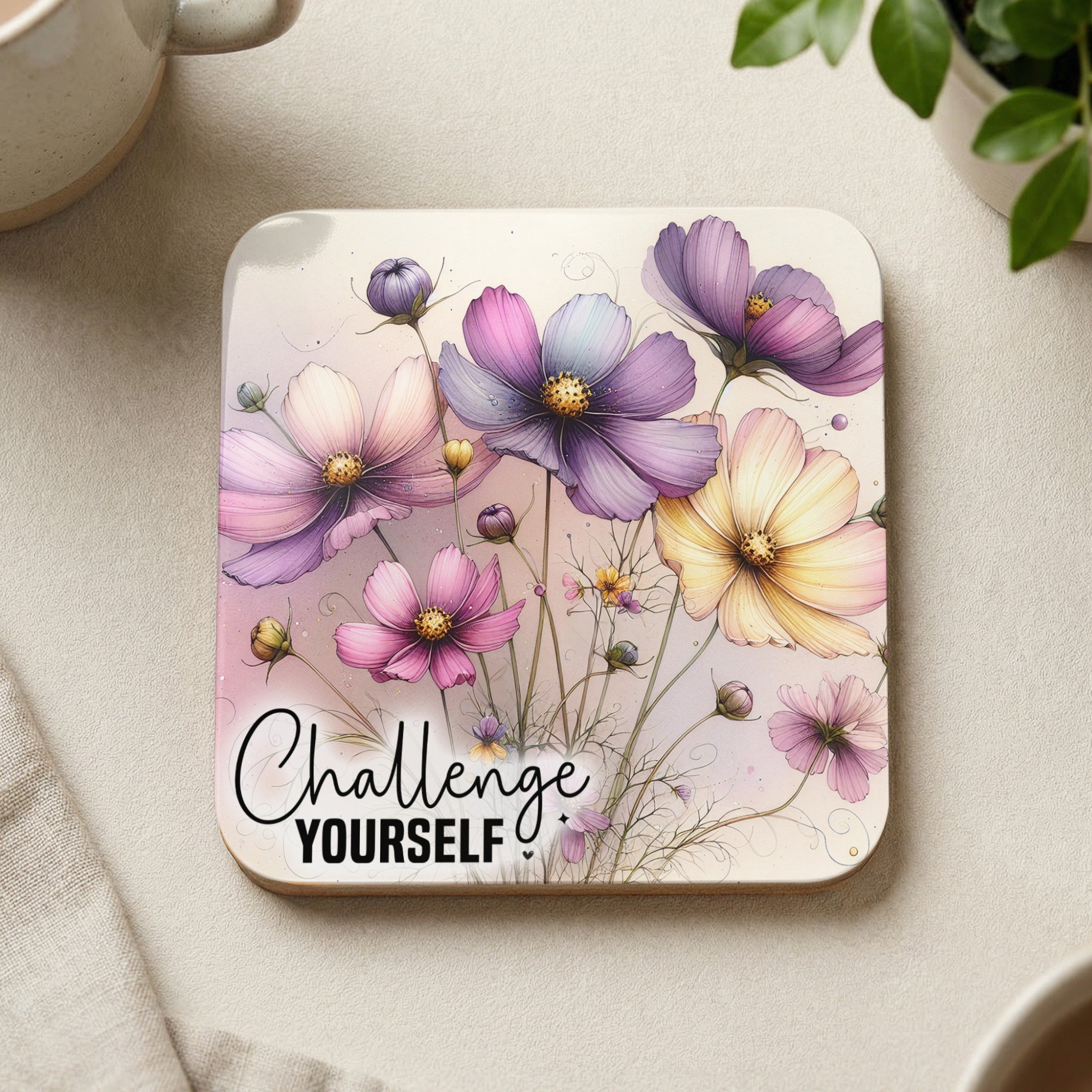 Square coaster with watercolor flowers and "Challenge Yourself" text.