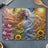 Woman with flowing hair representing seasons, butterflies, and sunflowers.