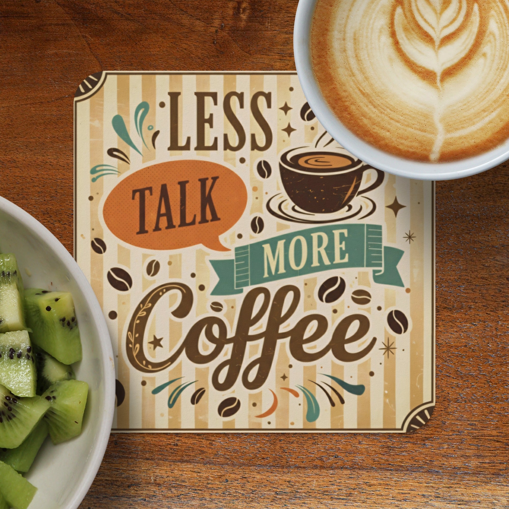 Coaster with "Less Talk More Coffee" text and latte art coffee.