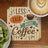 Coaster with "Less Talk More Coffee" text and latte art coffee.