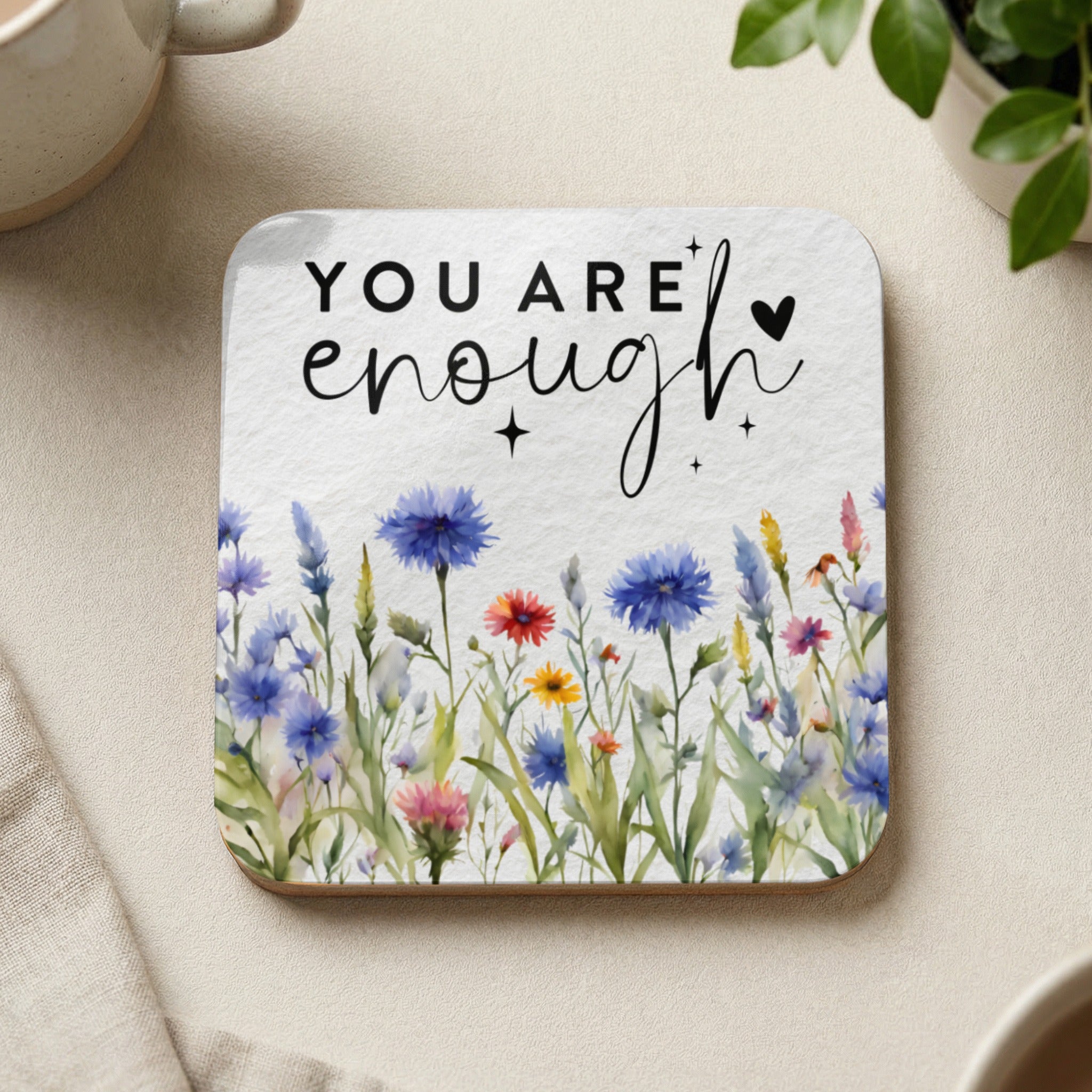 Square coaster with watercolor wildflowers and the text "YOU ARE enough".
