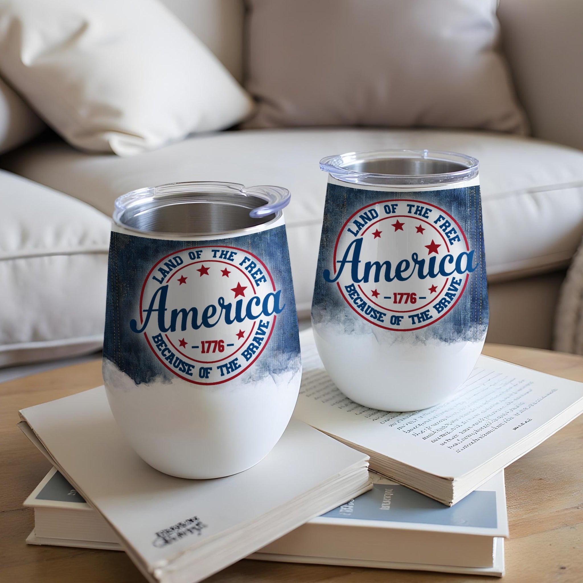 Two white tumblers with "America Because of the Brave 1776" text.