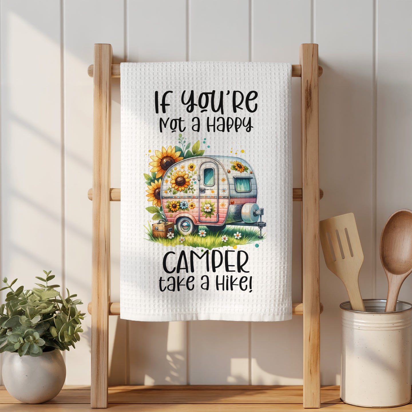 Towel with camper, sunflowers, and text "If you're not a happy camper take a hike!"