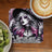 Gothic woman with pink hair and tattoos, text "This is your REMINDERS" on a coaster.
