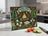 Glass cutting board with s'mores campfire scene and text "MAKING S'MORE MEMORIES."