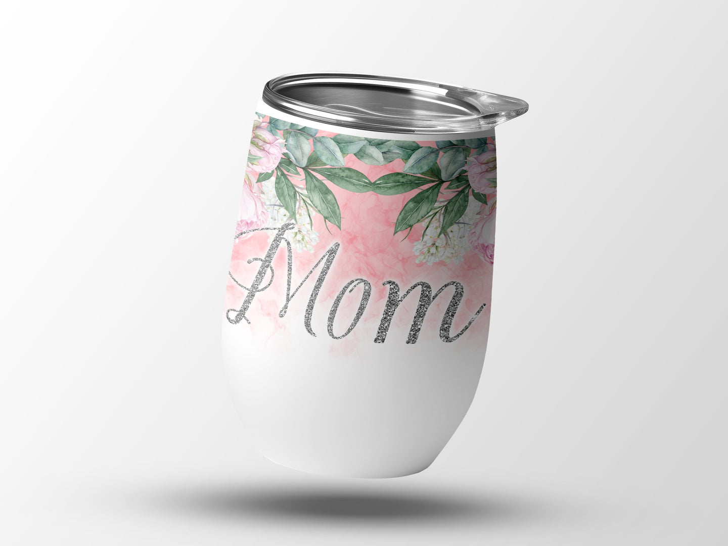 White tumbler with pink floral design and "Mom" in glitter text.