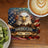 Coaster with eagle, American flag, and "America 250 1776 - 2026" text.