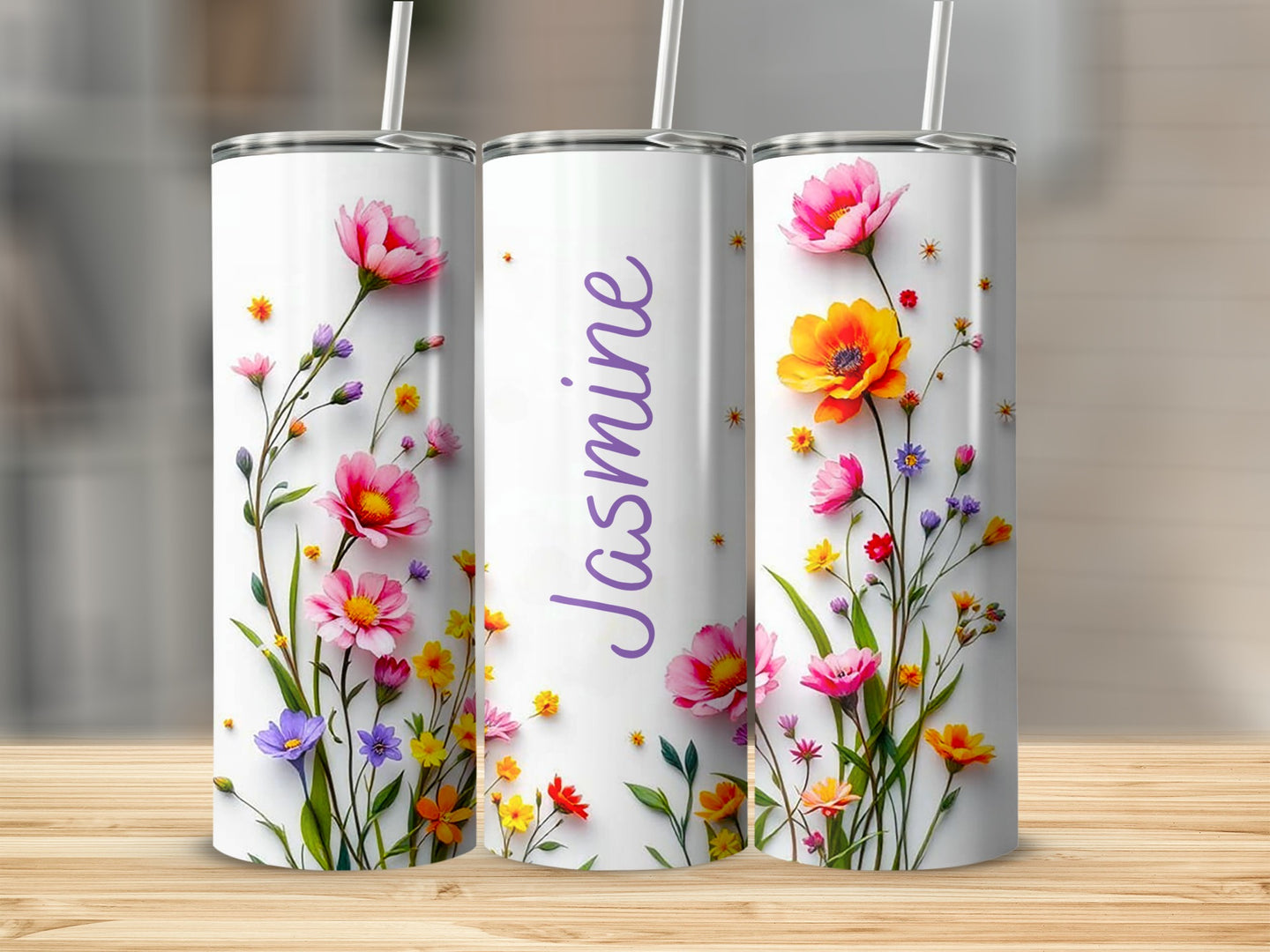 Three tumblers with floral designs and the name "Jasmine" on the middle tumbler.