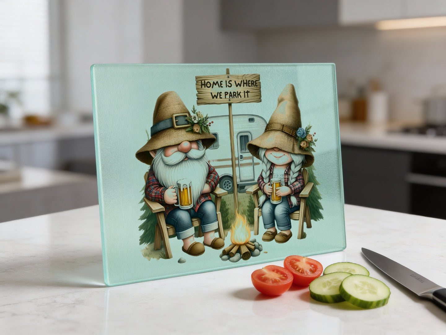 Gnomes in hats by campfire and RV, text "Home is where we park it".