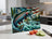 Rainbow trout leaps from a river with American flag design on cutting board.