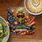 Coaster with torch, fireworks, and American flag, celebrating 250 Years of Freedom 1776-2026.