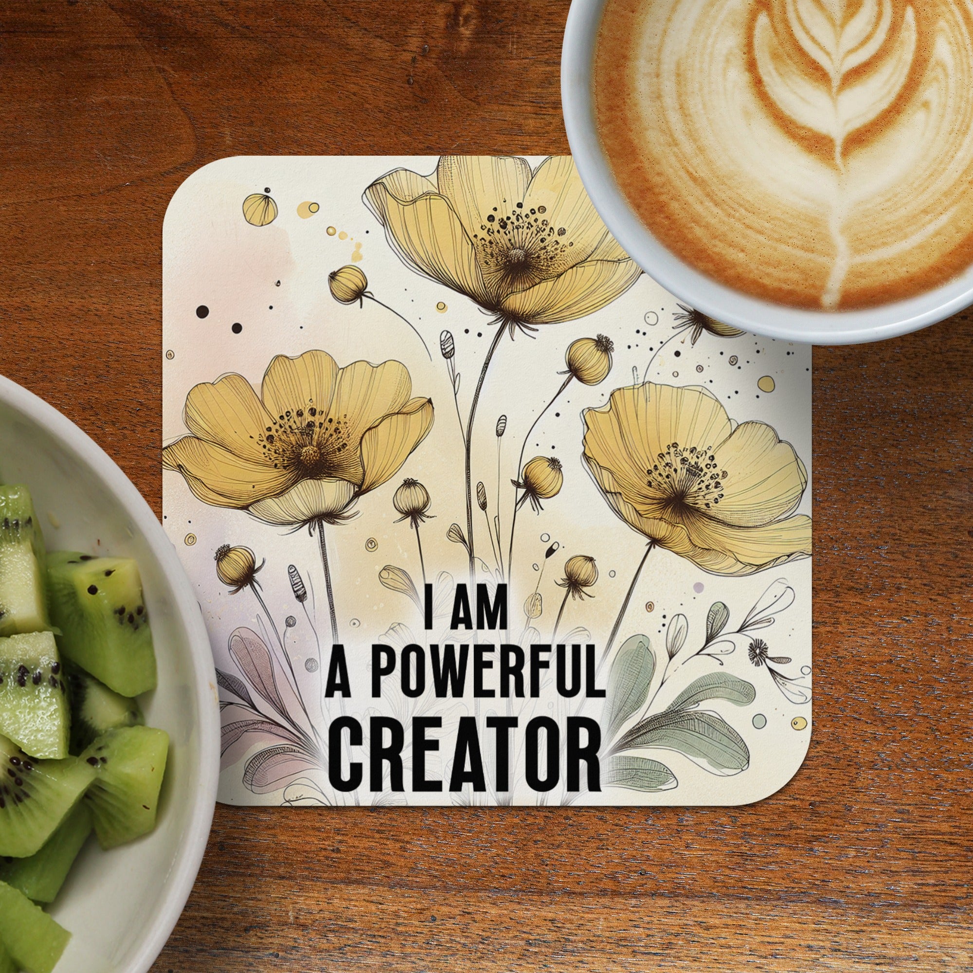 Coaster with yellow flowers and text "I AM A POWERFUL CREATOR".