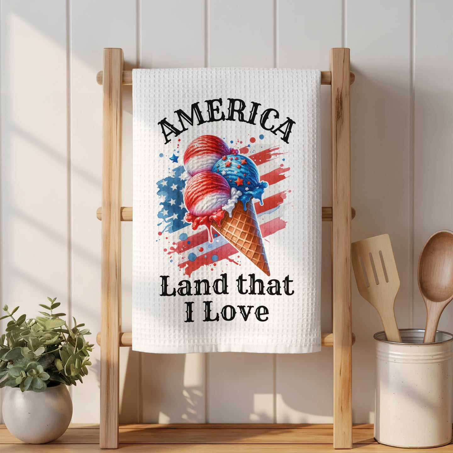Ice cream cone with American flag colors and text "America Land That I Love".