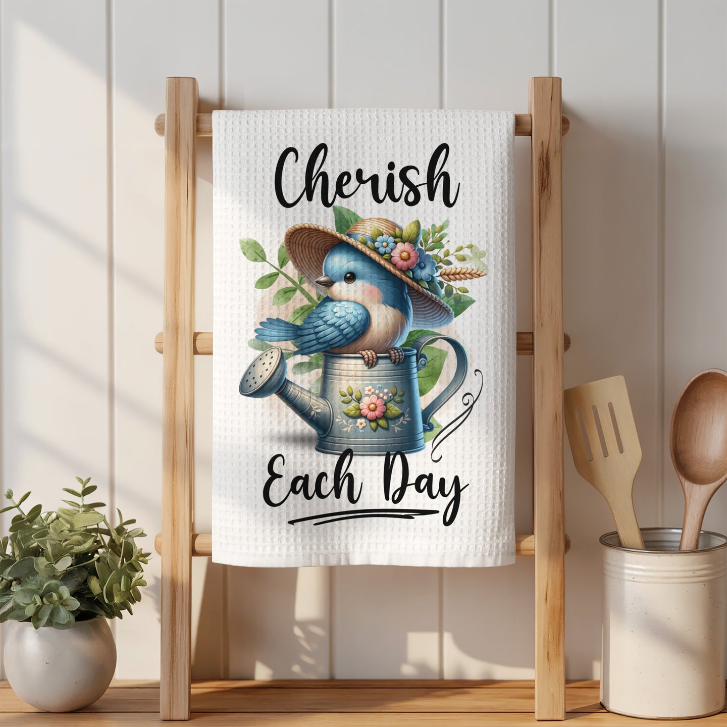 Blue bird on watering can with text "Cherish Each Day."