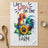 White tea towel with rooster, sunflower, and text "Life's better on the farm".