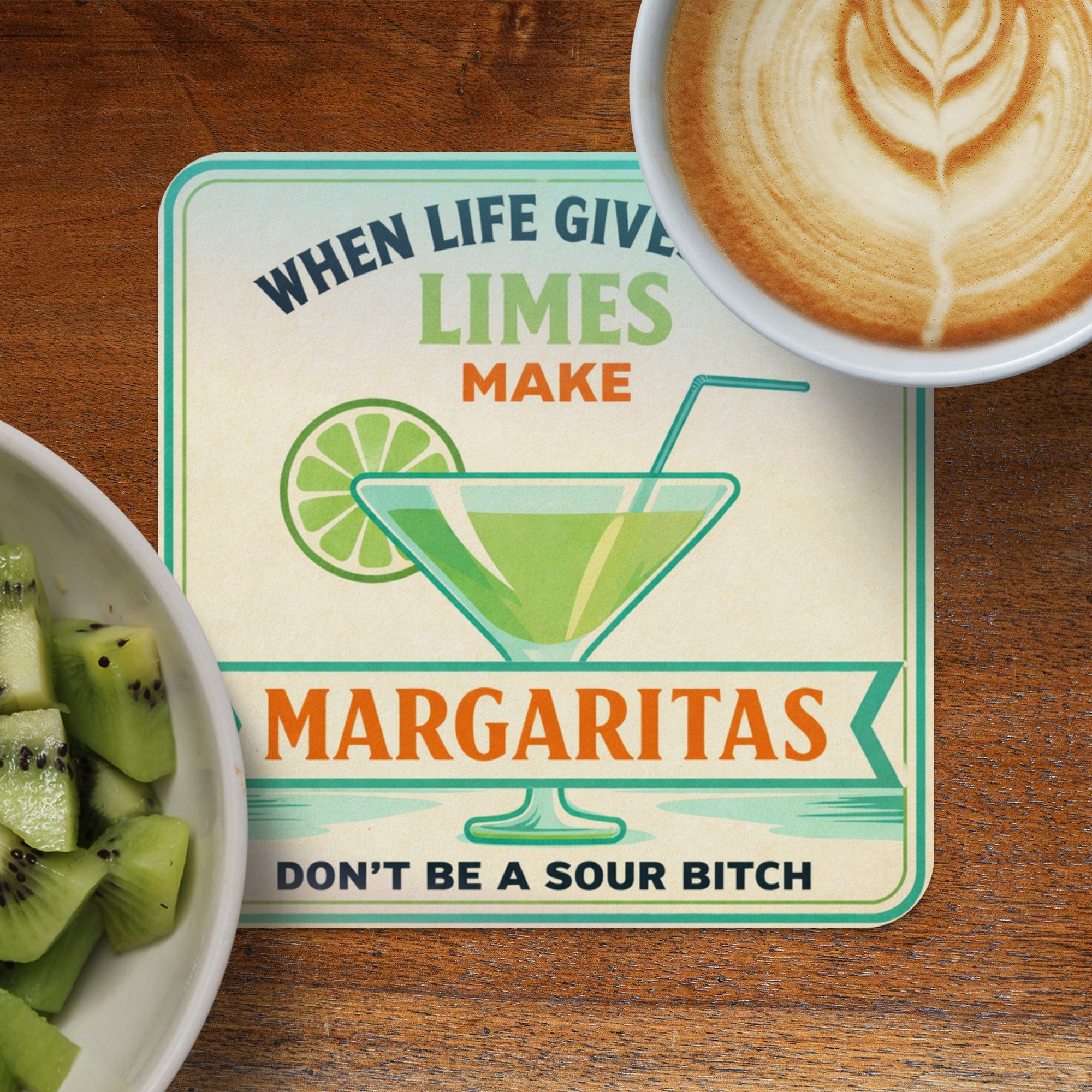 Coaster with margarita glass, lime, and text "When life gives limes, make margaritas."