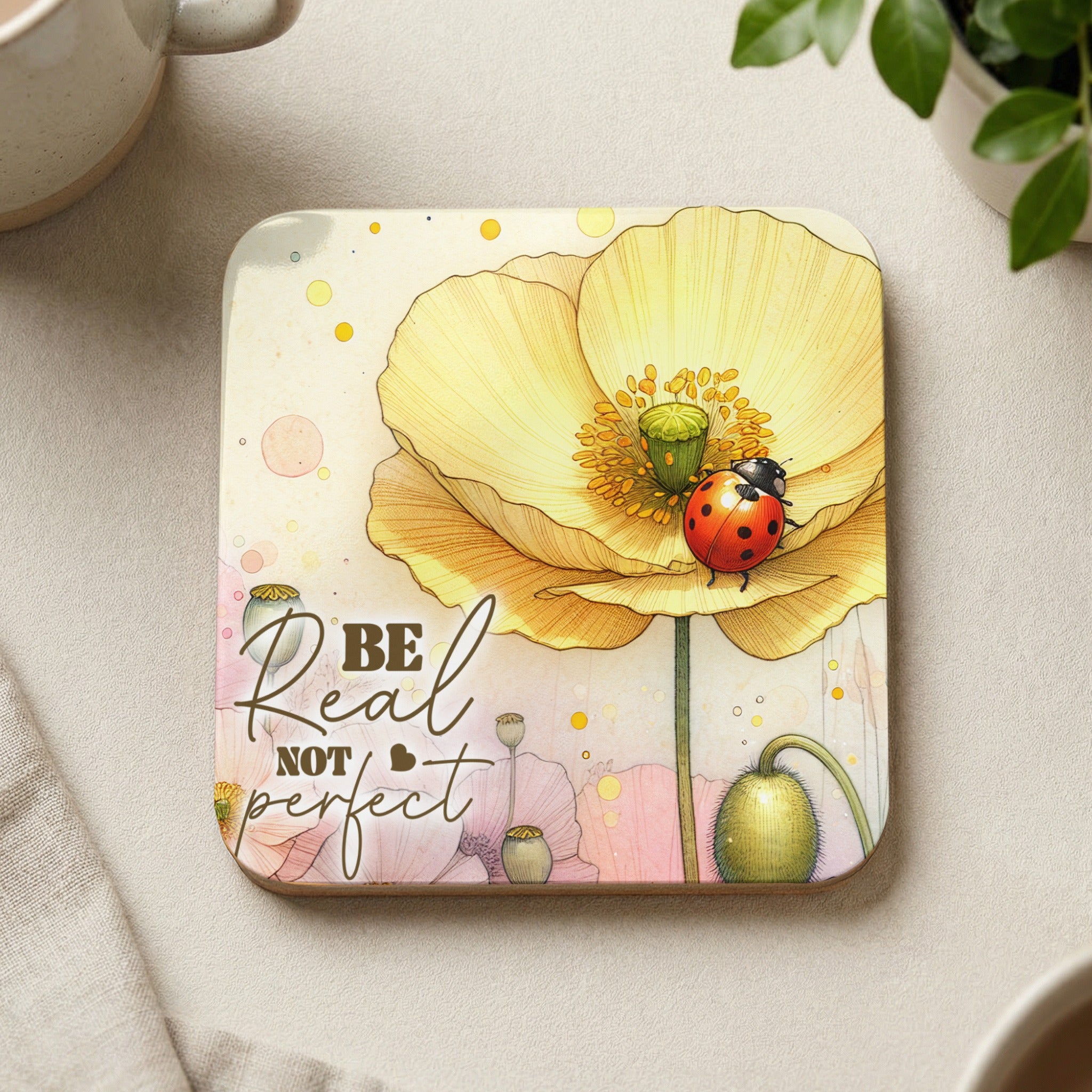 Yellow poppy with ladybug and "Be Real Not Perfect" text.