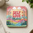 Coaster with "Self Love Matters" text and colorful rainbow hills with flowers.