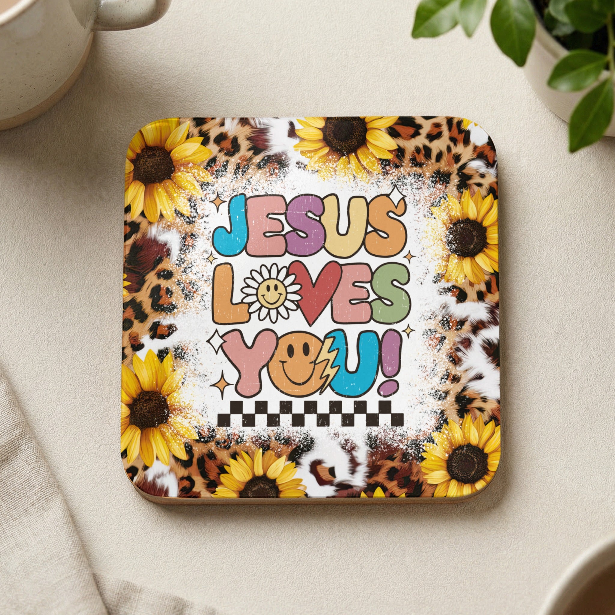 Sunflower and leopard print coaster with "Jesus Loves You!" text and smiley face.