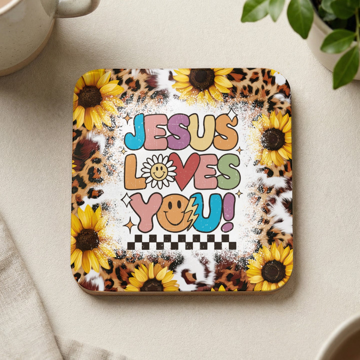 Sunflower and leopard print coaster with "Jesus Loves You!" text and smiley face.