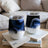 Two white wine tumblers with abstract blue and white marbling design.