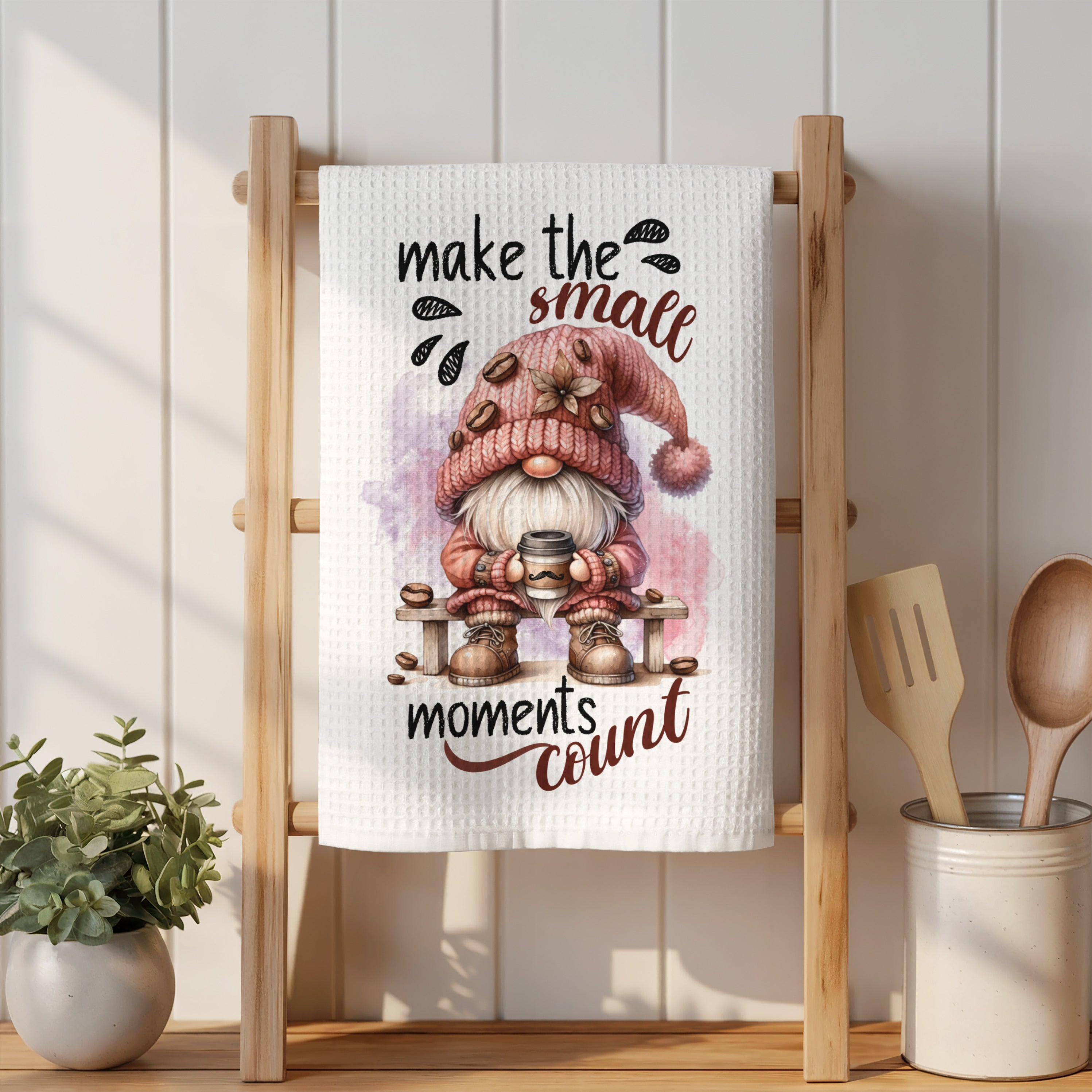 Gnome holding coffee mug with "make the small moments count" text.