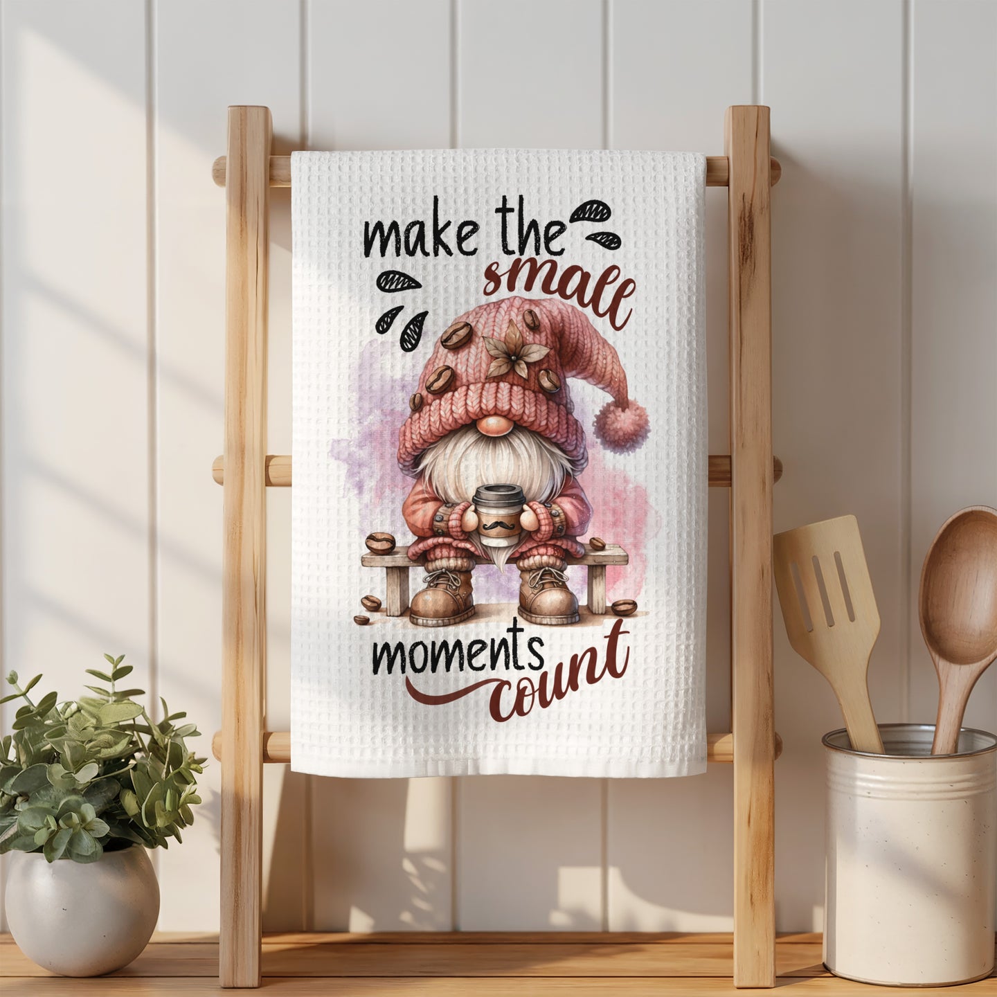 Gnome holding coffee mug with "make the small moments count" text.