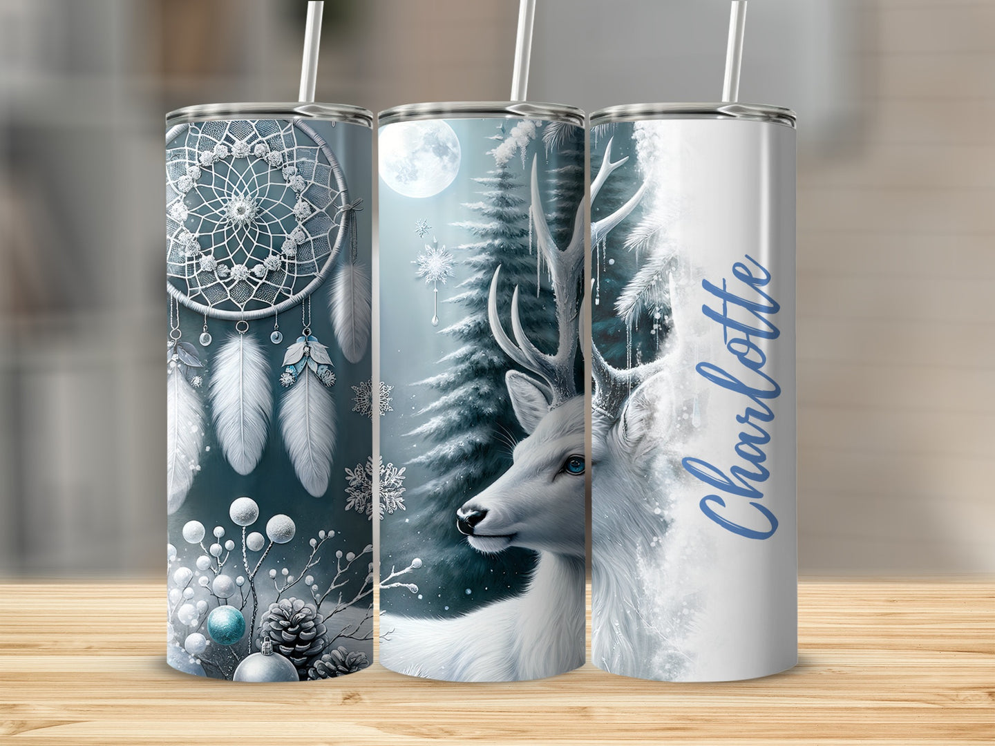 Three tumblers with winter and dreamcatcher designs, one with name "Charlotte".