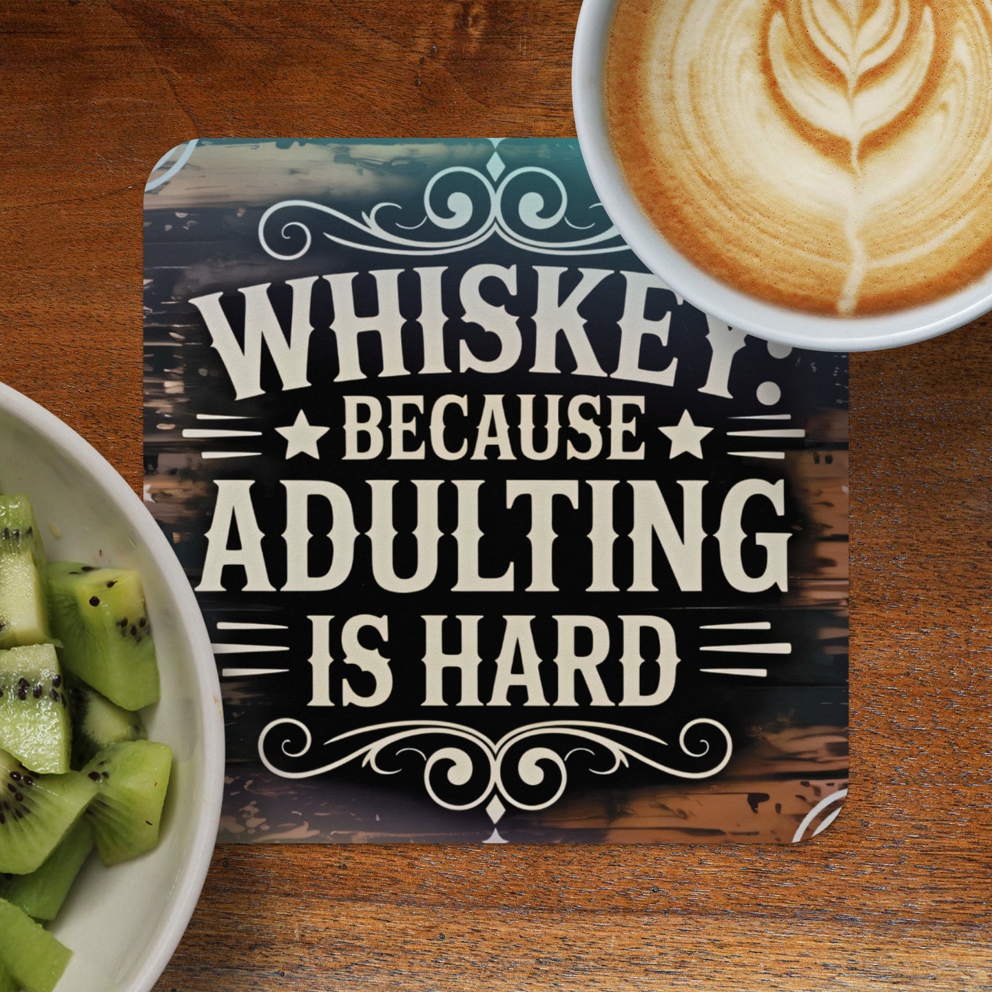 Coaster with "Whiskey Because Adulting is Hard" text and a cup of coffee.