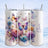 Three tumblers decorated with colorful butterflies and floral designs.