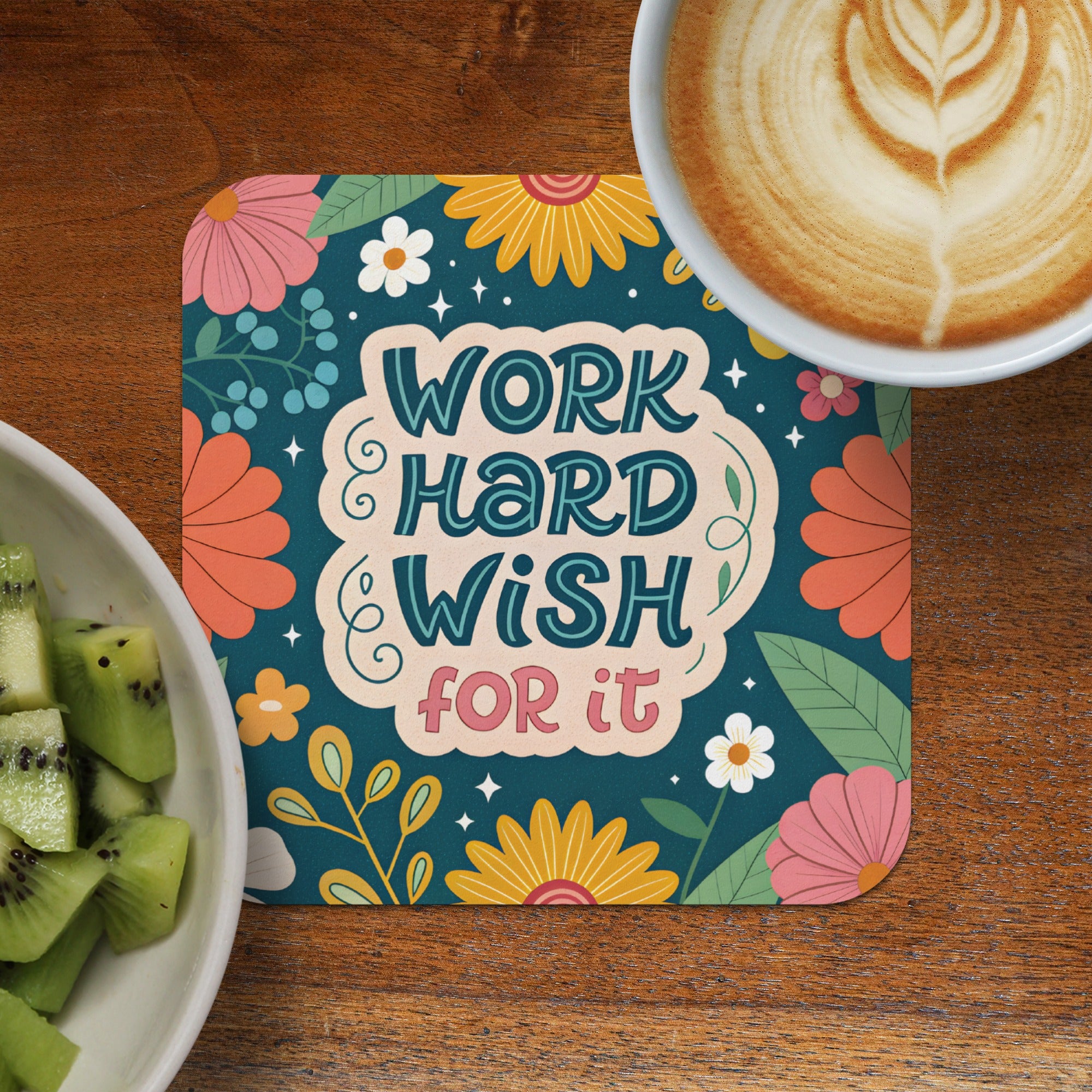 Coaster with "Work Hard Wish For It" text surrounded by floral illustrations.