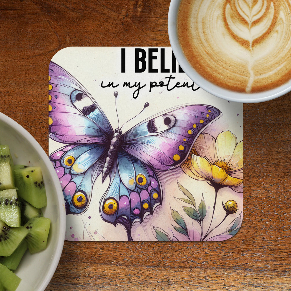 Coaster with purple butterfly, yellow flower, and text "I BELIEVE in my poten".