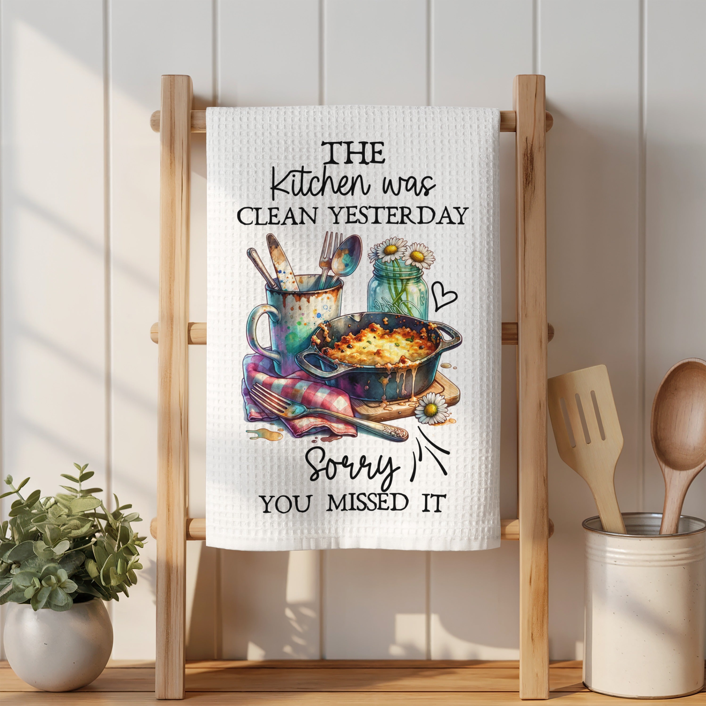 Tea towel with text "The kitchen was clean yesterday sorry you missed it".