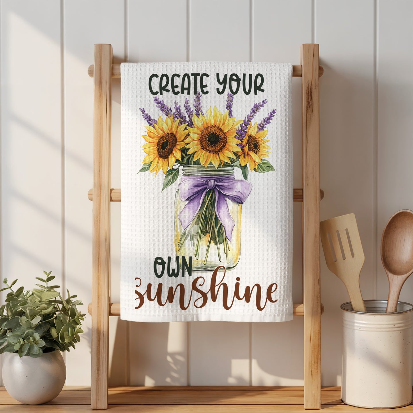Towel with sunflowers and lavender in a mason jar, reads "Create Your Own Sunshine".