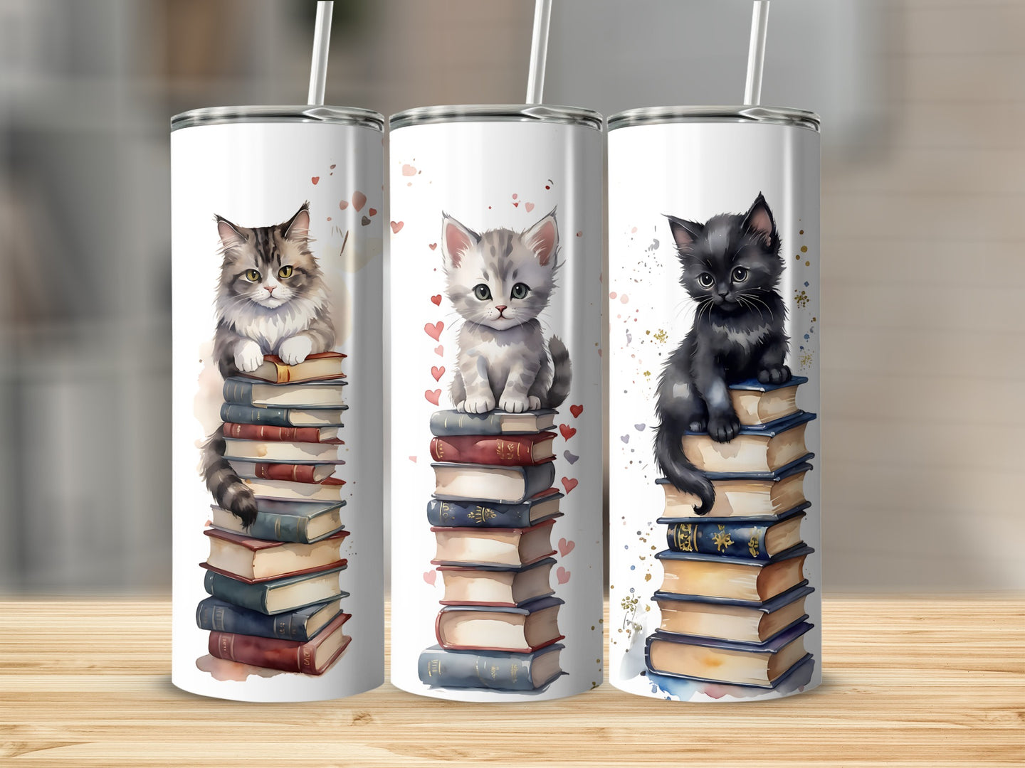 Three kittens sit atop stacks of books on a wooden surface.