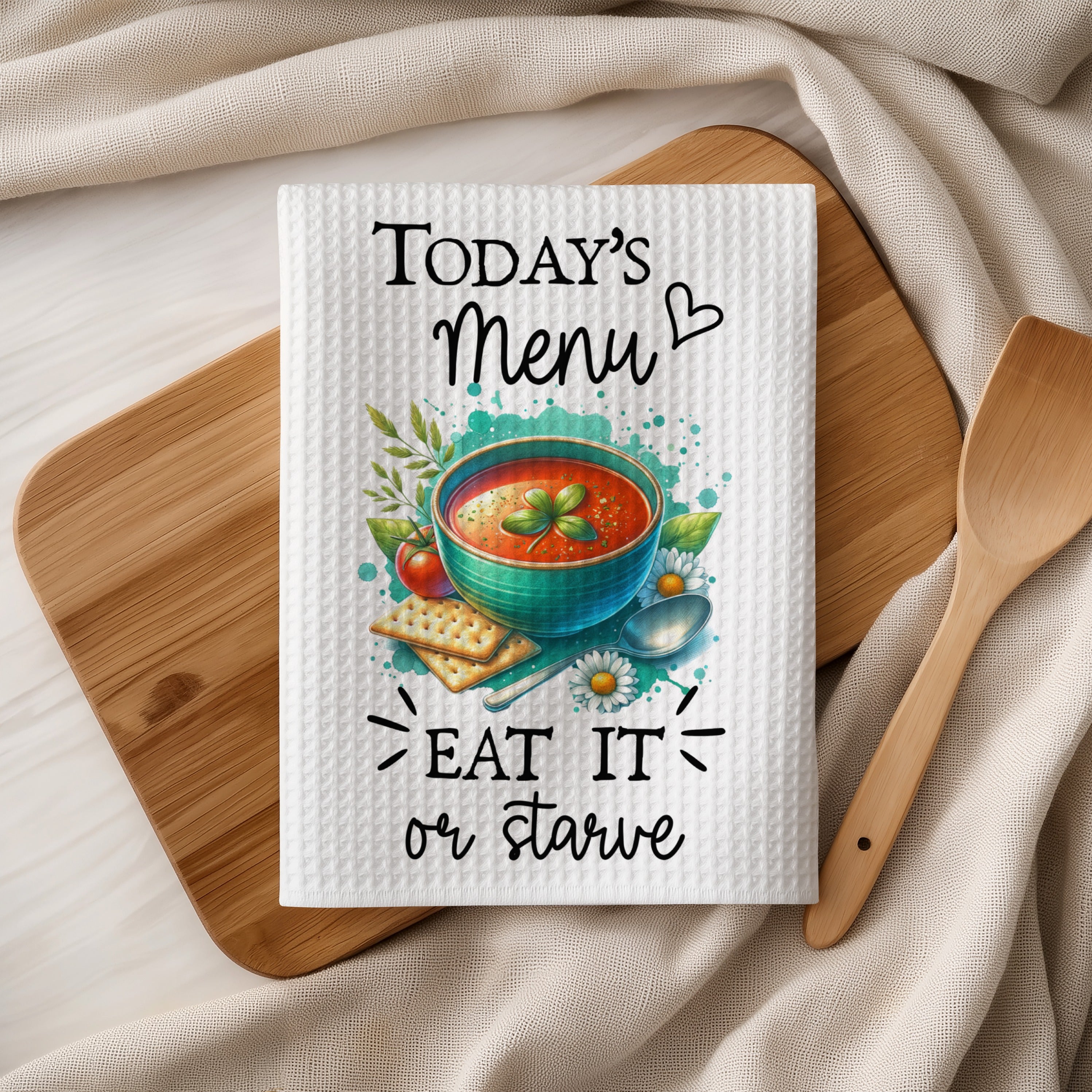 Tea towel with "Today's Menu: Eat It or Starve" and tomato soup graphic.