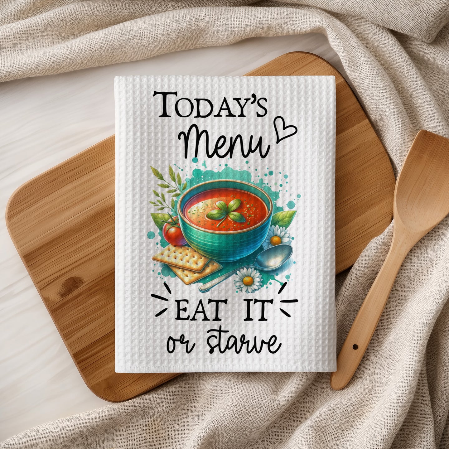 Tea towel with "Today's Menu: Eat It or Starve" and tomato soup graphic.