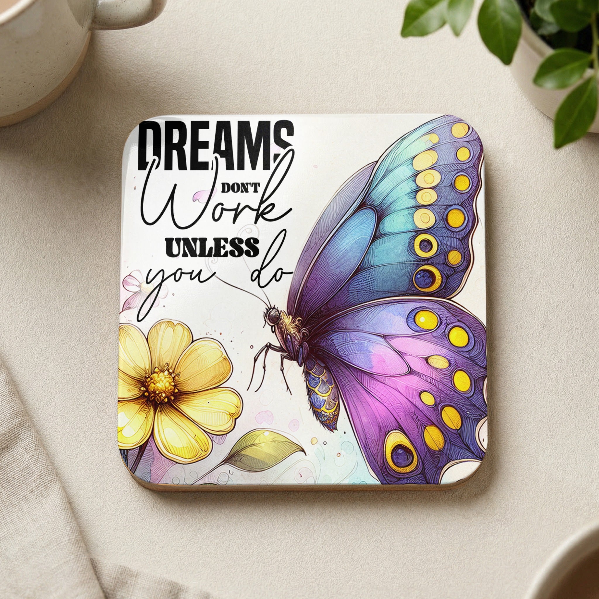Coaster with a butterfly, flower, and text that reads "Dreams work unless you do".