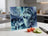 Wolf and dreamcatcher art on a cutting board with tomatoes and cucumber slices.