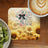 Jesus loves me this I know graphic on a sunflower background with a coffee and kiwi fruit.