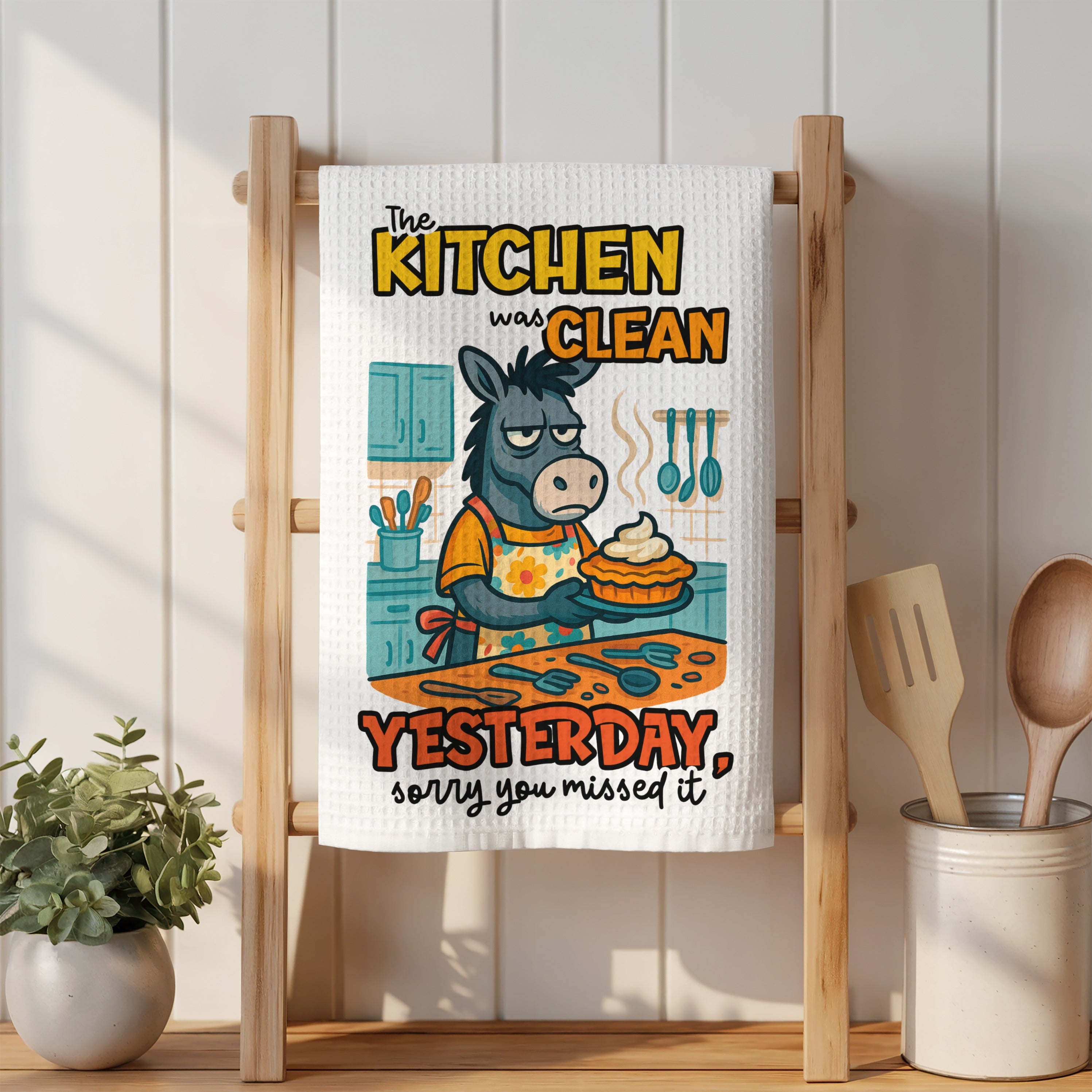 Donkey wearing apron holding pie, text reads "The kitchen was clean yesterday, sorry you missed it".