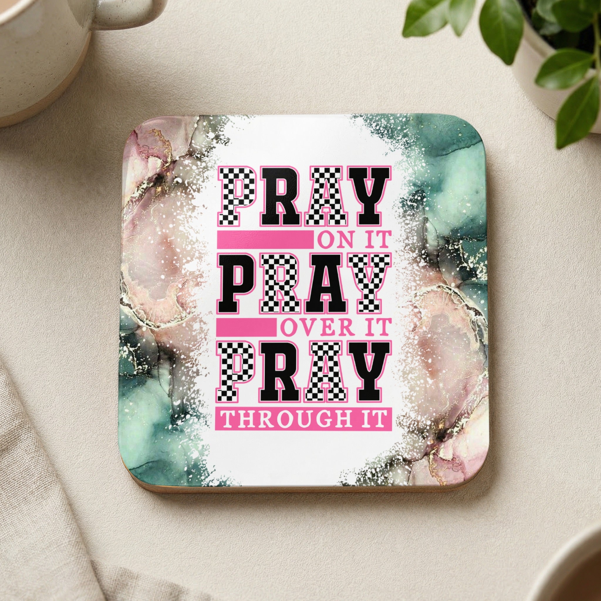 Coaster with pink and green marble design and text "Pray on it, Pray over it, Pray through it".