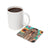 Mug of coffee next to a coaster with a woman and sunflowers.