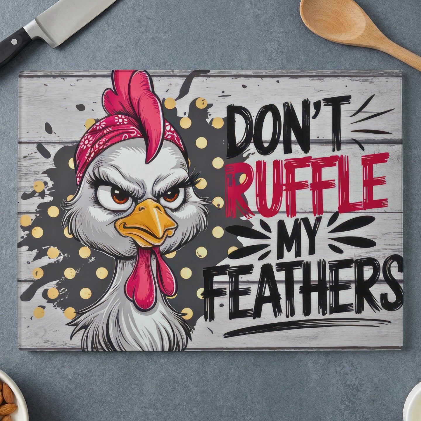 Chicken with bandana and text "DON'T RUFFLE MY FEATHERS" on cutting board.