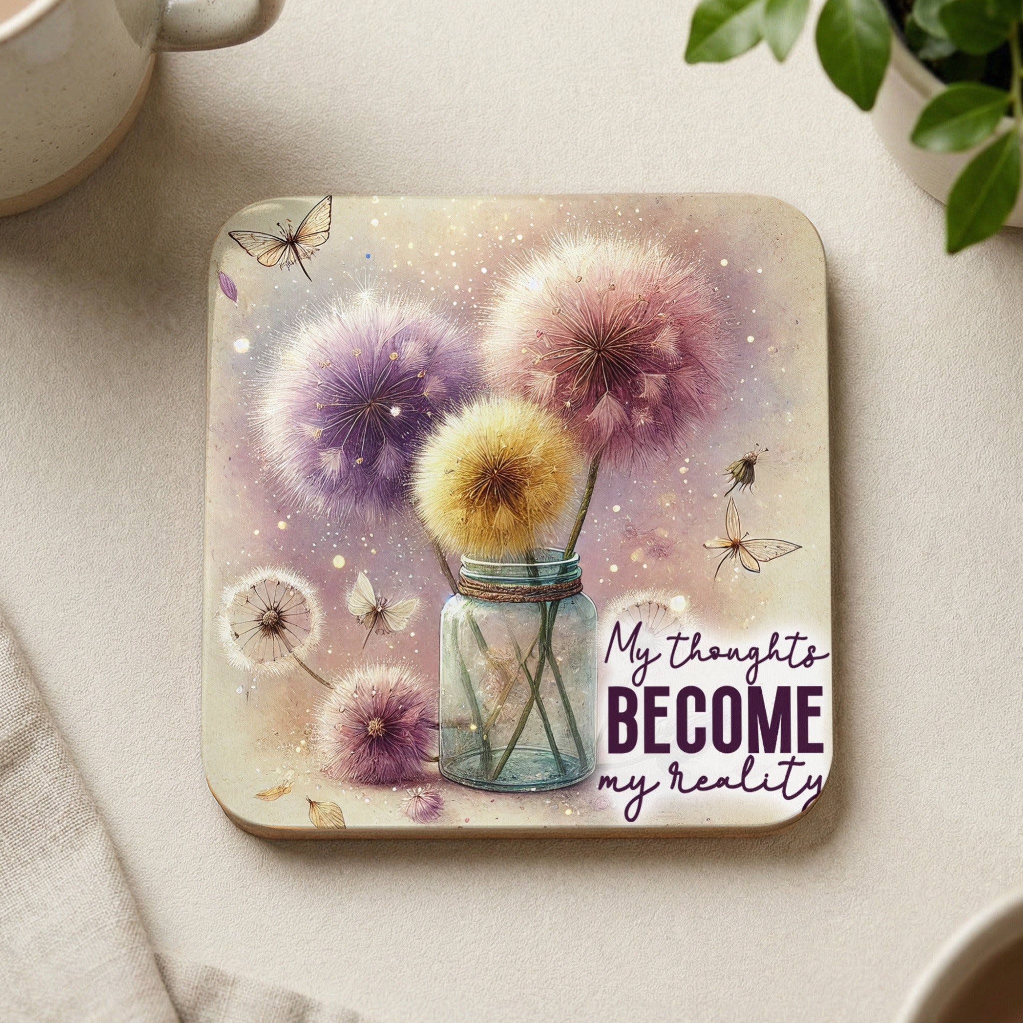 Coaster with dandelions, butterflies, and text "My thoughts become my reality".